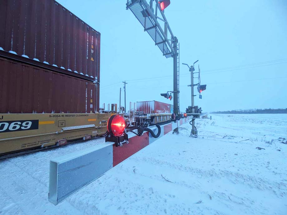 A train blocks a grade crossing.