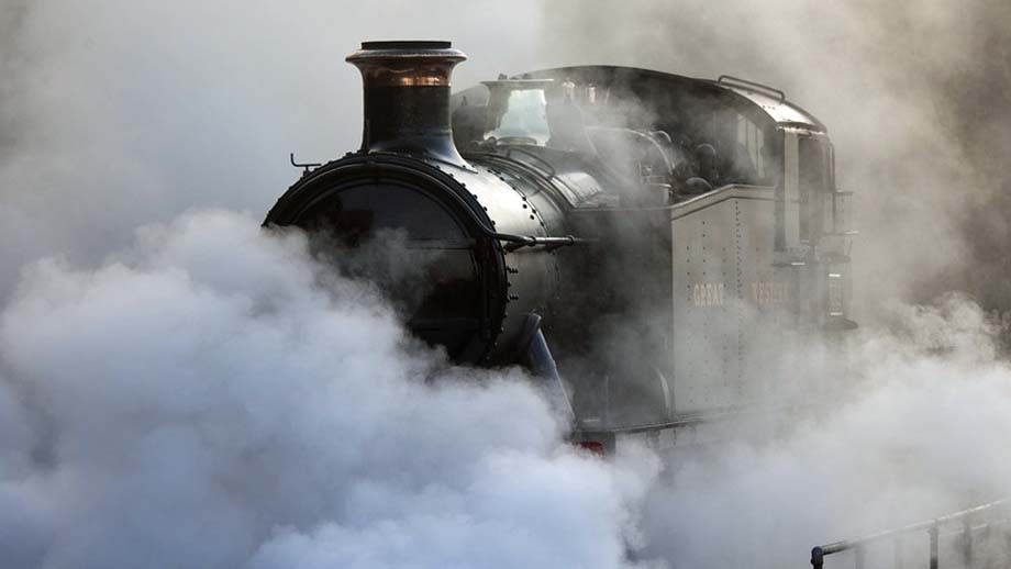 Restricted visibility around a steam locomotive.