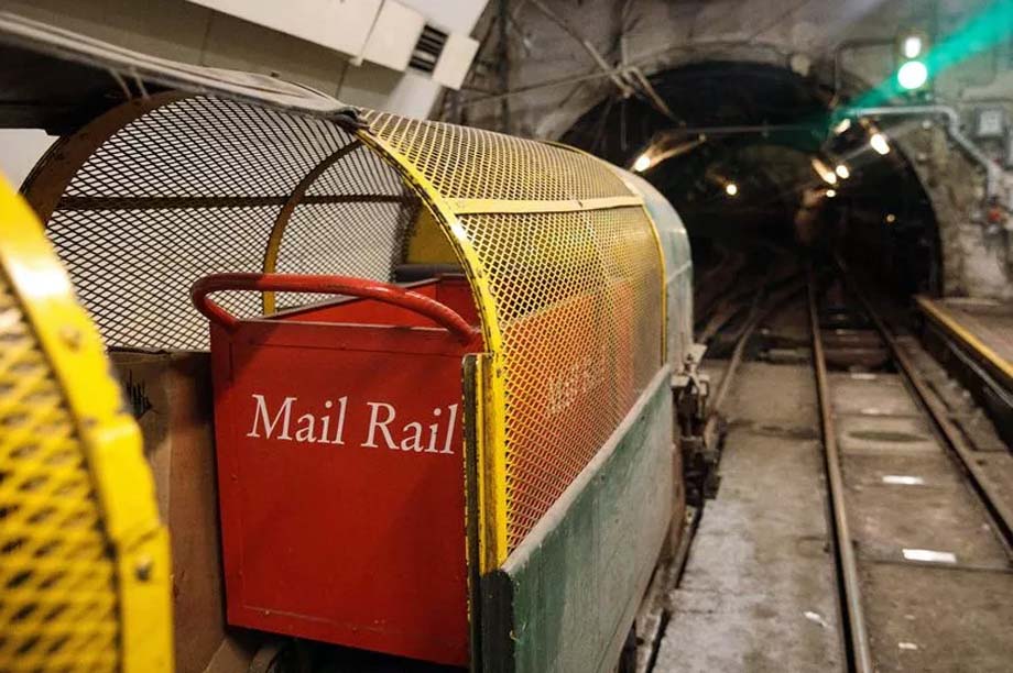 A Mail Rail car at a station.