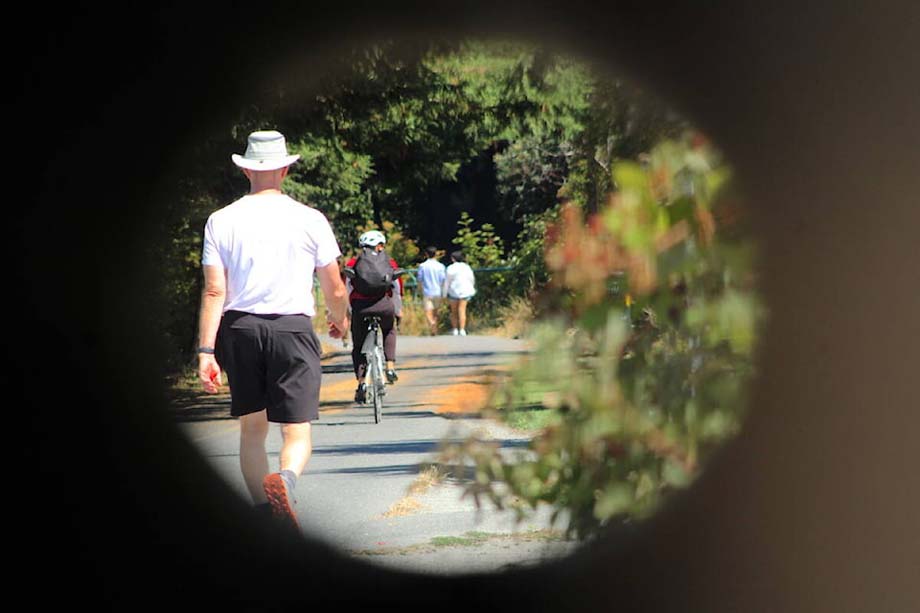 Pedestrians and cyclists near the Selkirk Trestle.