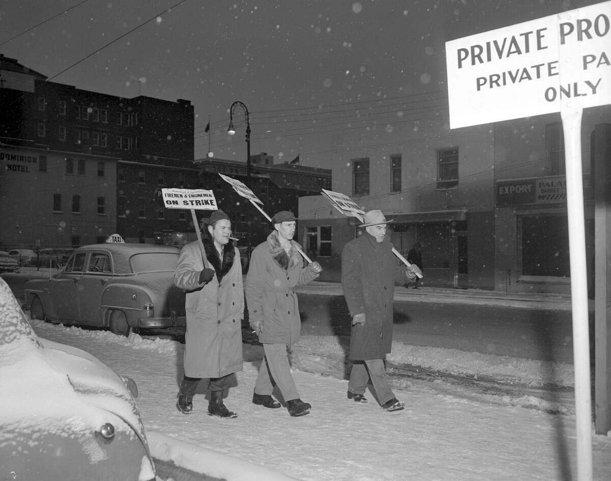 3 members of the Brotherhood of Fireman and Enginemen picketing