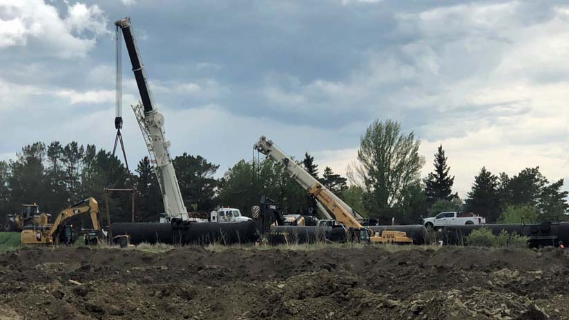 Three derailed tank cars.