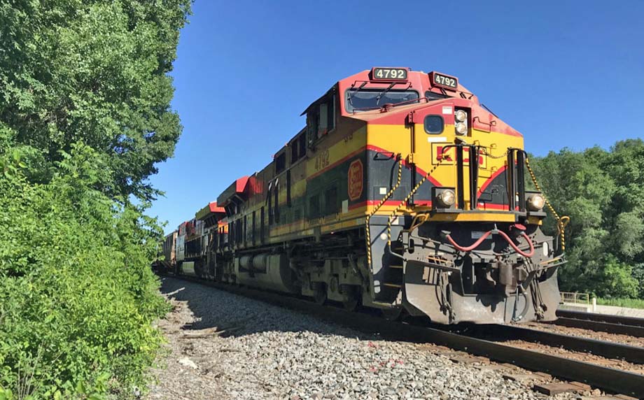 Two KCS locomotives lead a CP train.