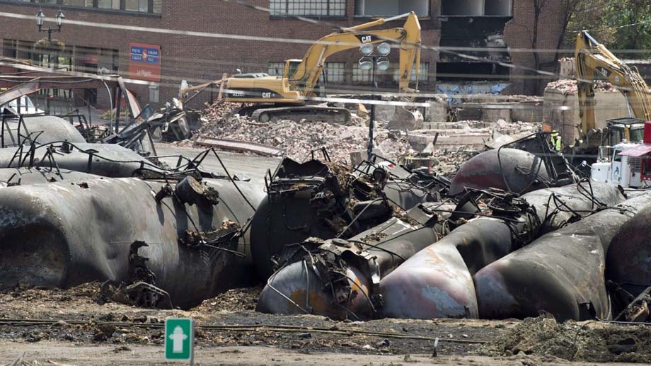 Excavators on the site of a train crash.