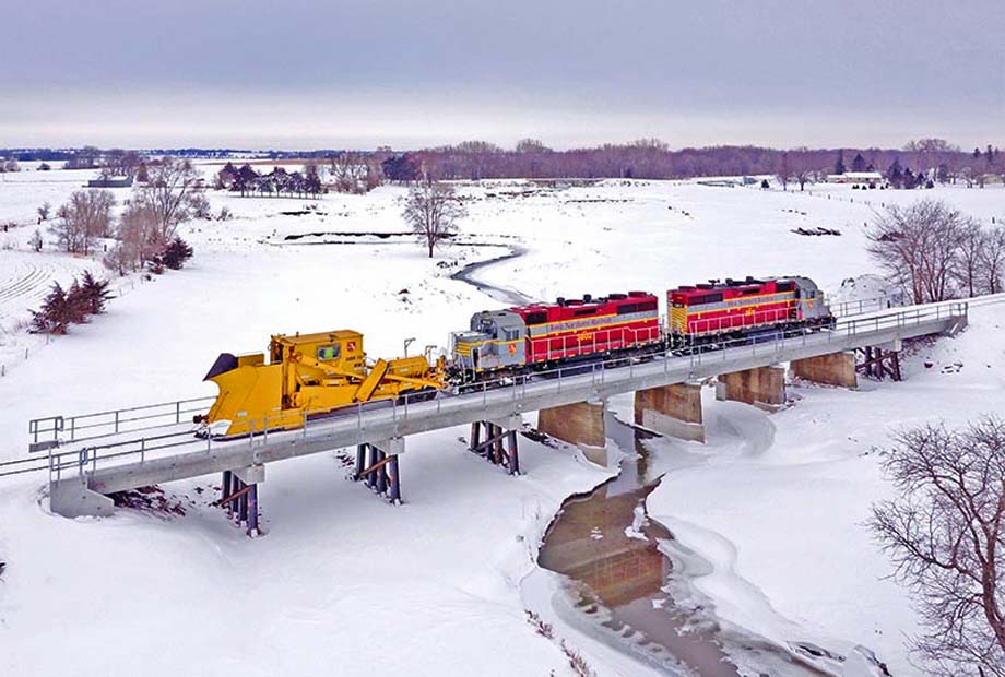 Iowa Northern units push a Jordan spreader.