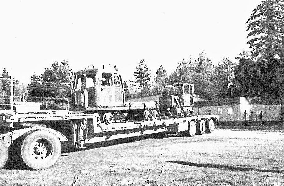 The two rail cars arrive at Kaltasin on a flatbed truck.